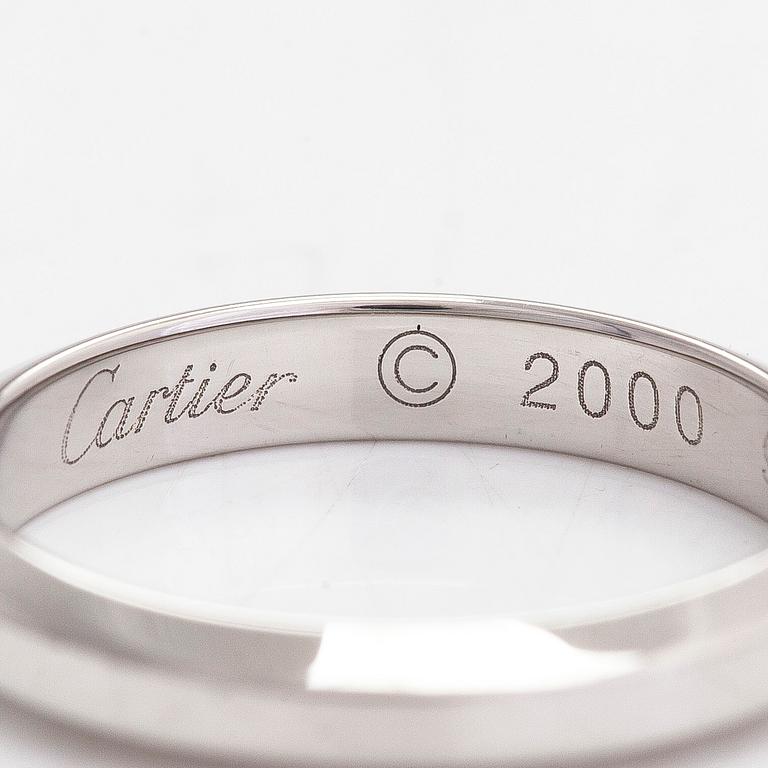 Cartier, a platinum ring. With certificate.