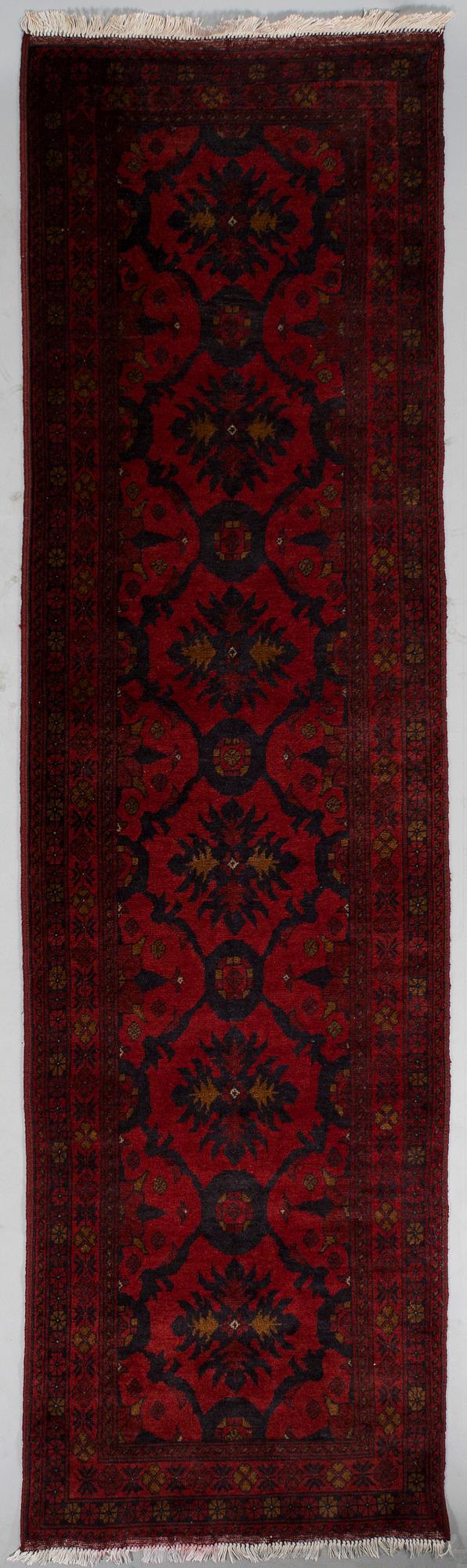 An Afghan runner, ca. 295 x 82 cm.