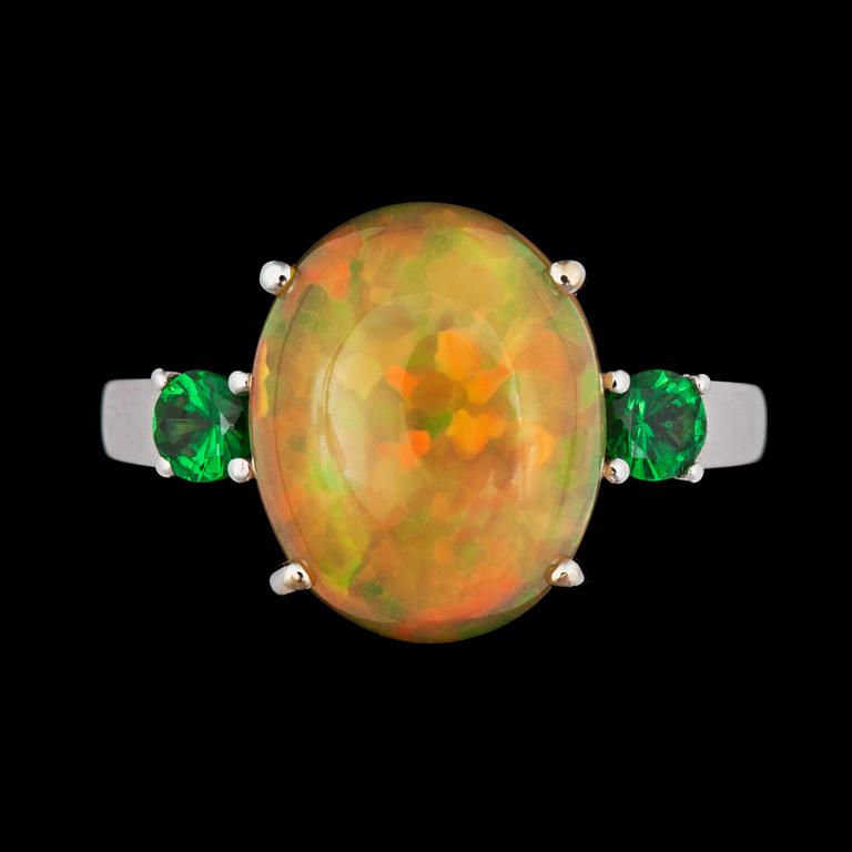 A 4.26 cts Ethiopian fire opal and 0.40 ct tsavorite garnet ring.