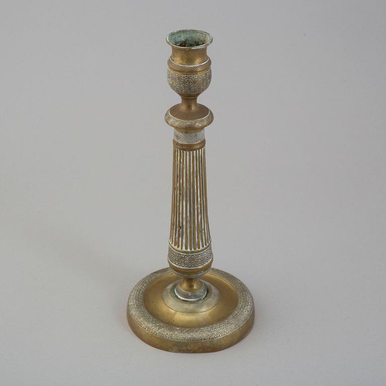 A first half of the 19th century Empire bronze candlestick.