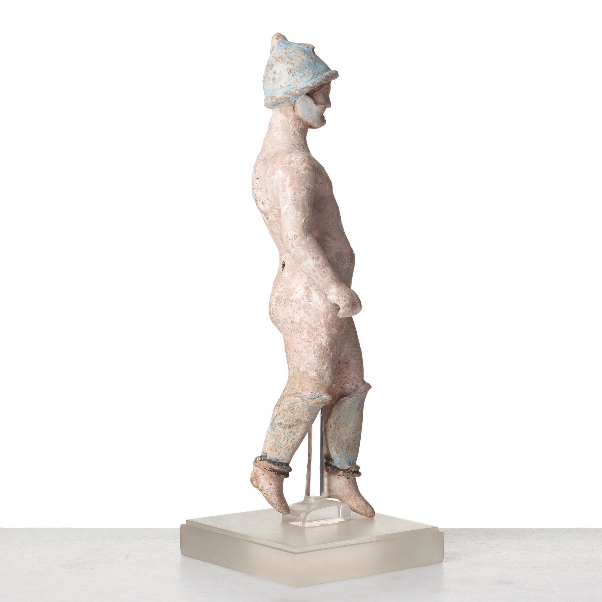 A Greek terracotta sculpture of a warrior, Hellenistic period, Canosa, 3rd Century B.C.