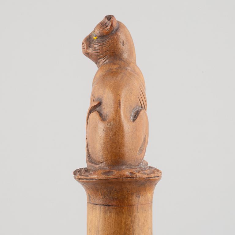A carved wooden letter opener in the manner of Sophia Isberg, 19th century.