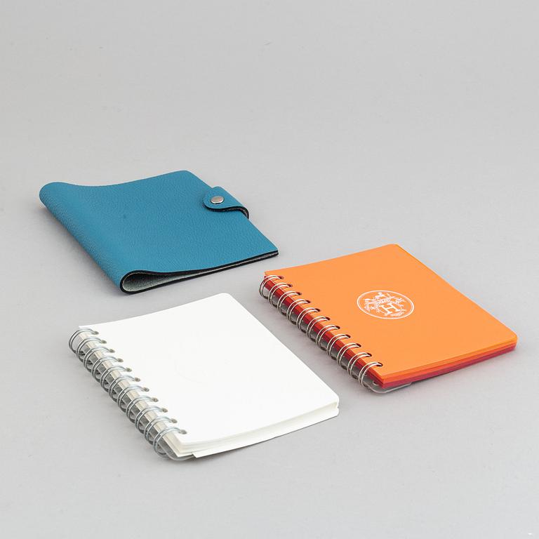 Hermès, a blue leather notebook with two scripple pads.