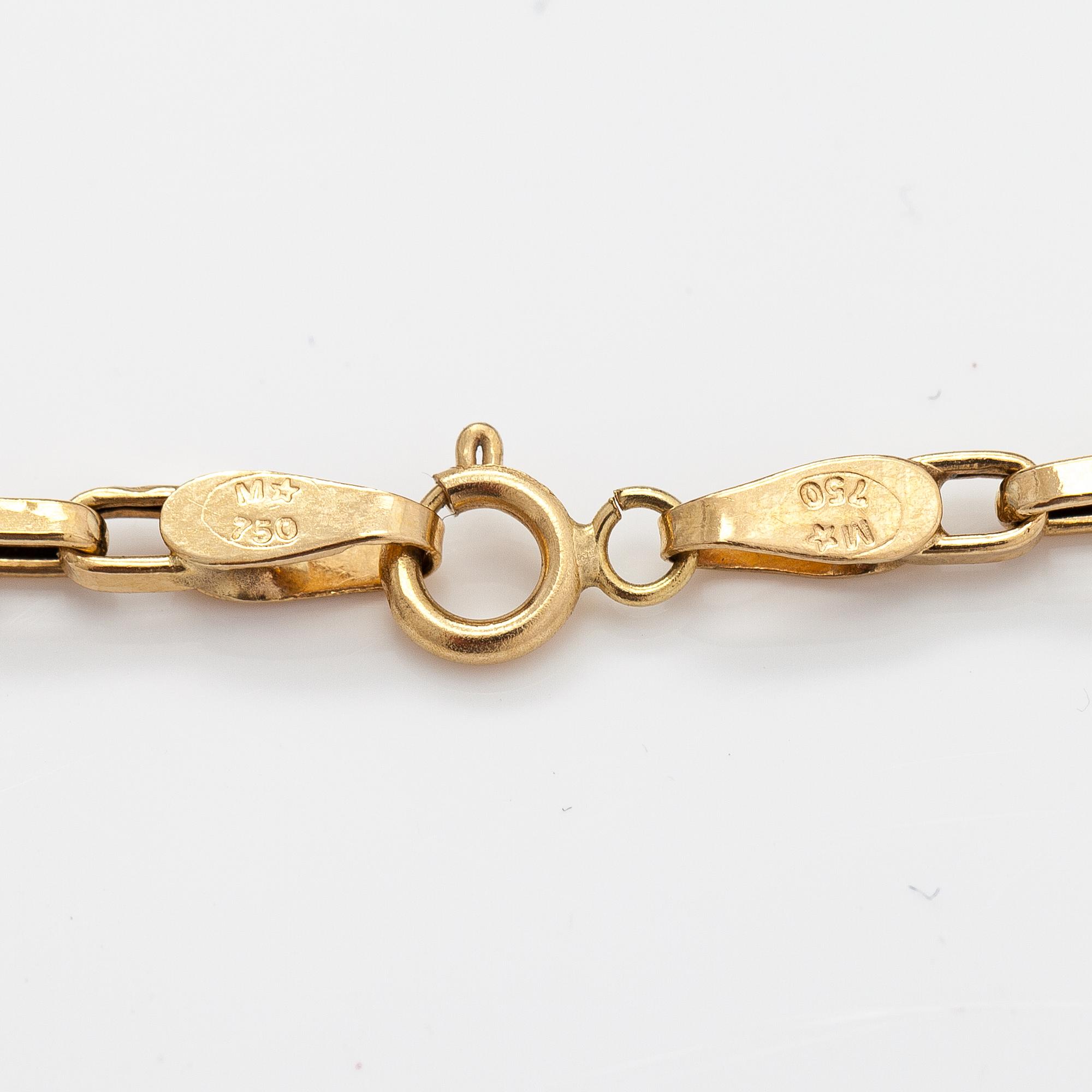 An 18K gold necklace with a garnet, peridote, amethyst and topaz.