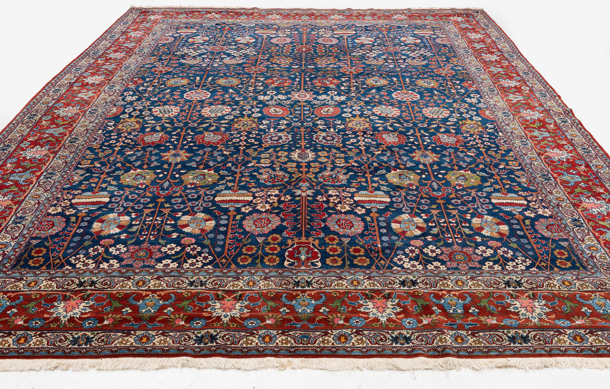 A semi-antique Qum carpet of Safavid design, Central Persia (Iran), c. 416 x 315 cm.