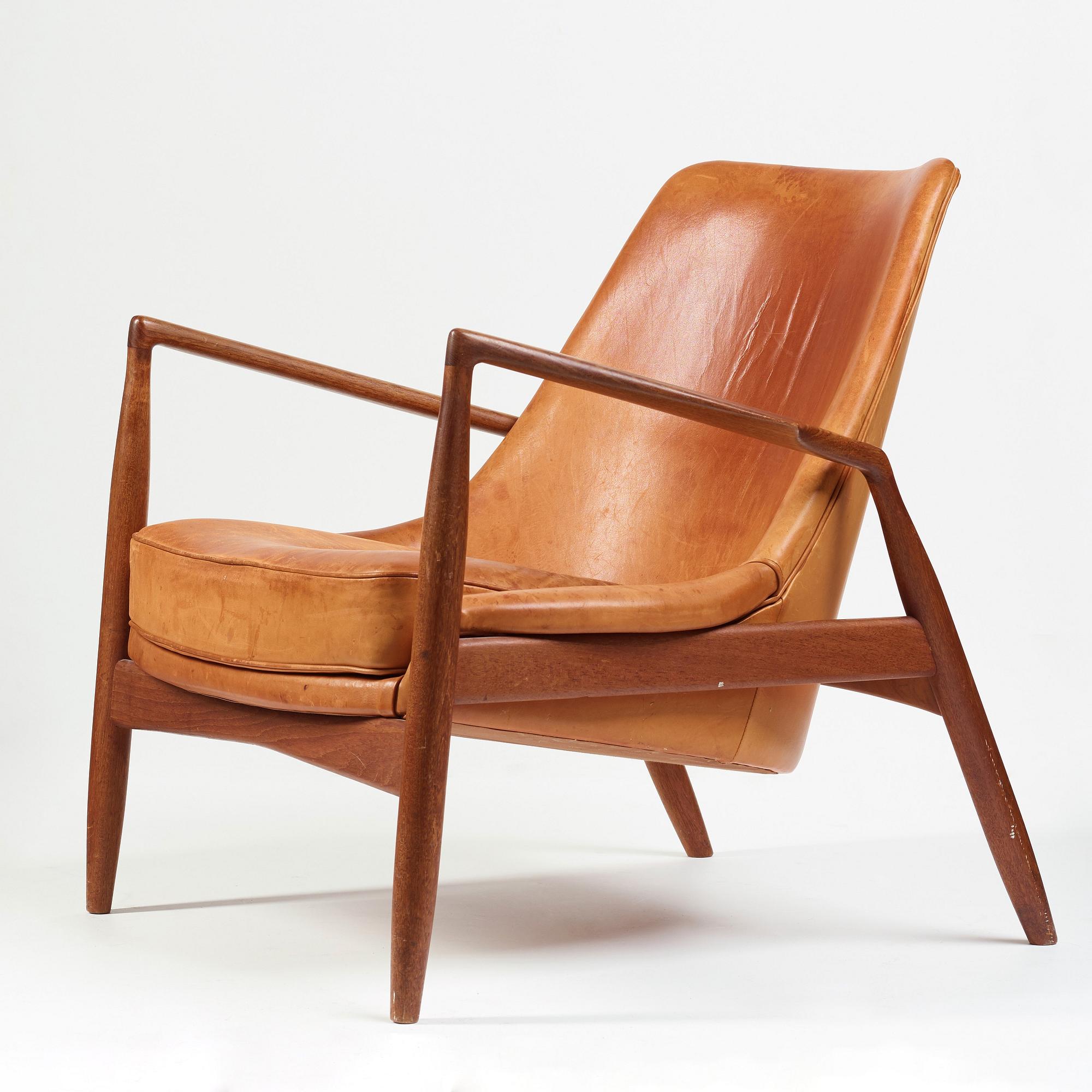 Ib Kofod-Larsen, a "Seal" teak and brown leather armchair, Olof Persson Möbler, Jönköping, Sweden 1950-60's.