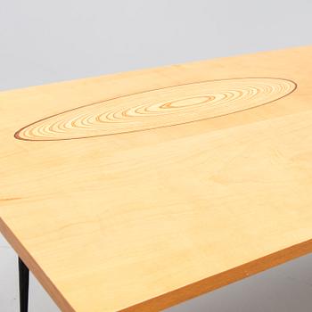 A coffee table marked Tapio Wirkkala, Asko, Made in Finland.