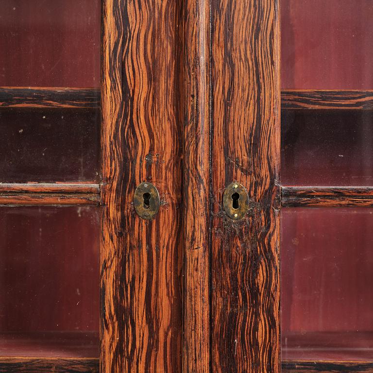 A Swedish faux-boix neo-gothic book cabinet, ca 1830.