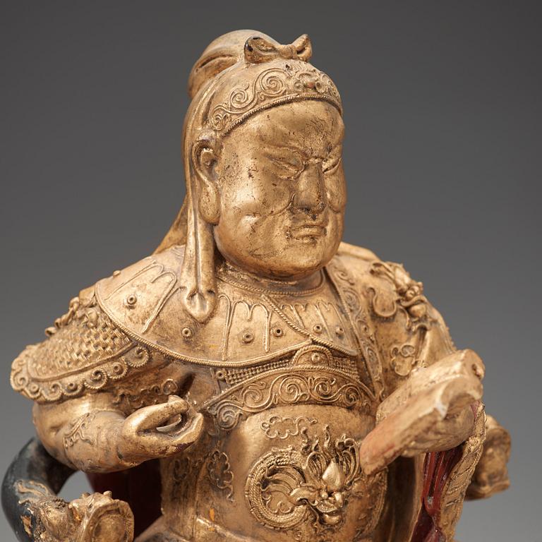 A wood, gilt and lacquered figure of Zhenwu, Qing dynasty, presumably Qianlong (1736-1795).