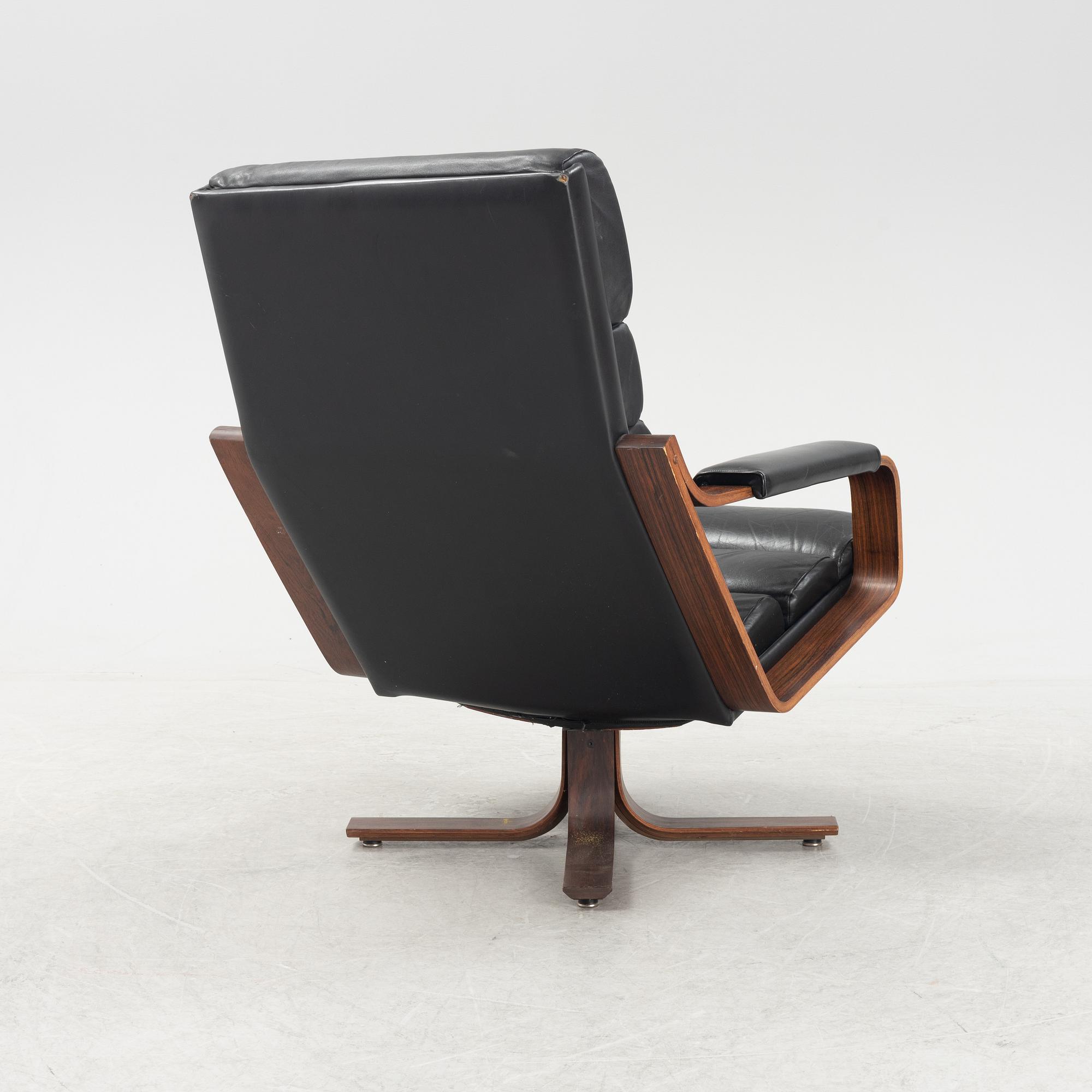 Karl-Erik Ekselius, a rosewood swivel armchair from JOC Vetlanda, 1980's.