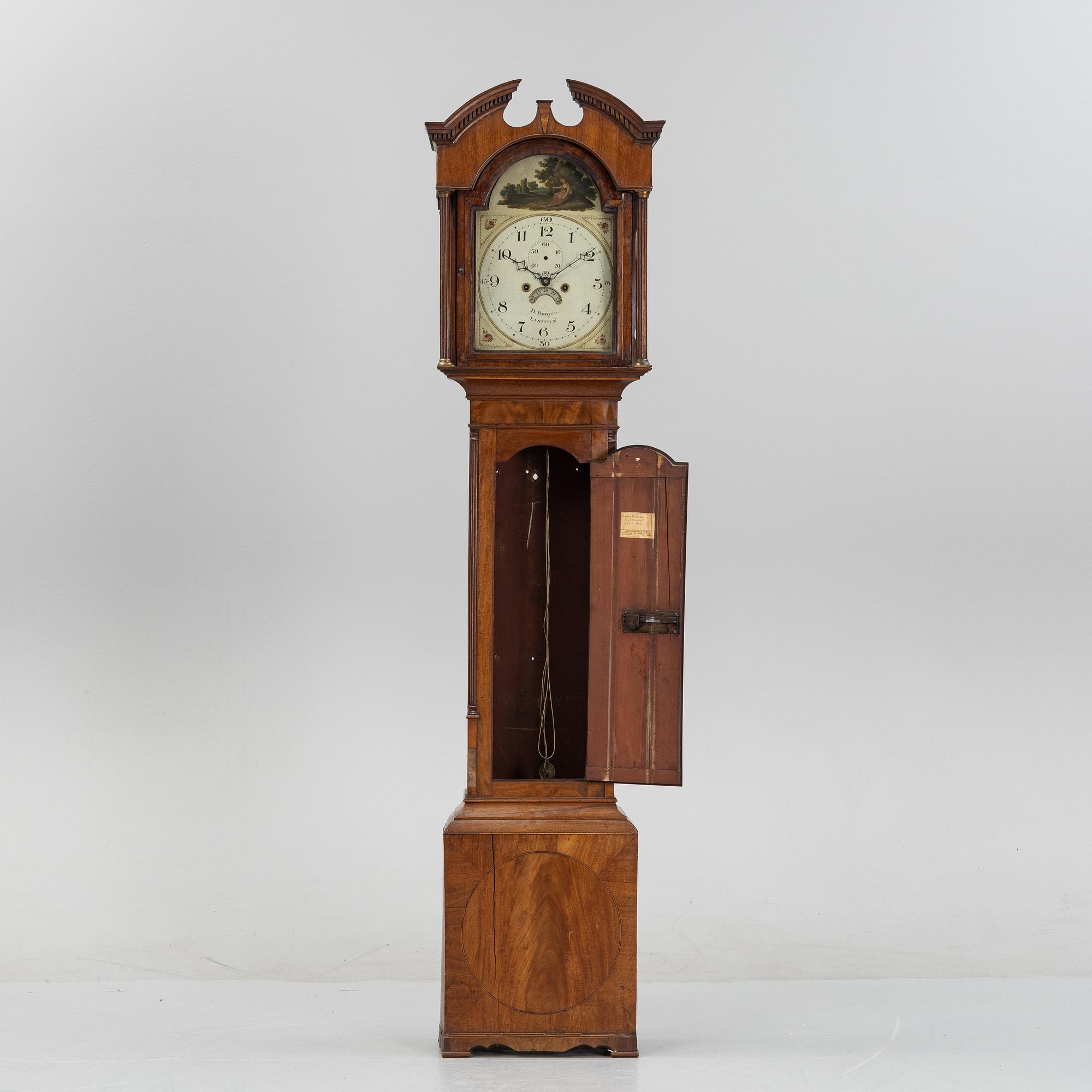 A mahognay long case clock from around the year 1800, H Bunyan Lincoln.