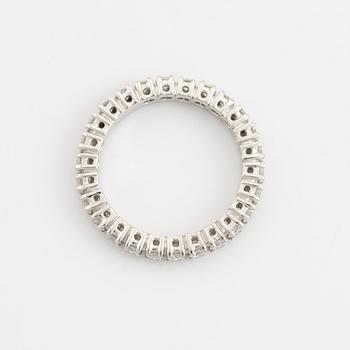 Brilliant cut diamond eternity ring.