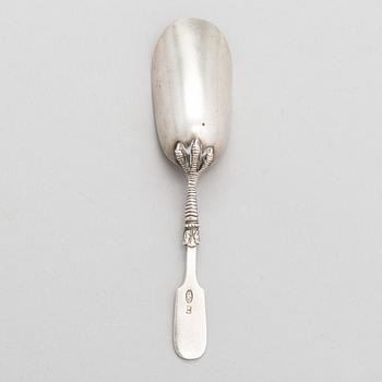 A Russian silver, parcel-gilt tea caddy spoon, Moscow from around the turn of teh century/ early 20th century.
