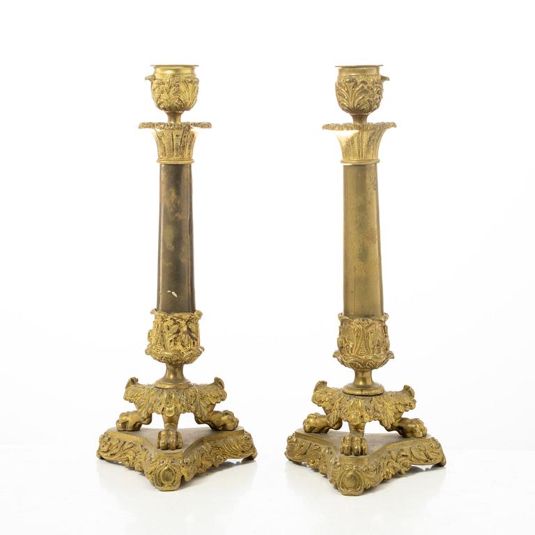 A pair of brass and bronze late Empire candle sticks, mid 20th century.