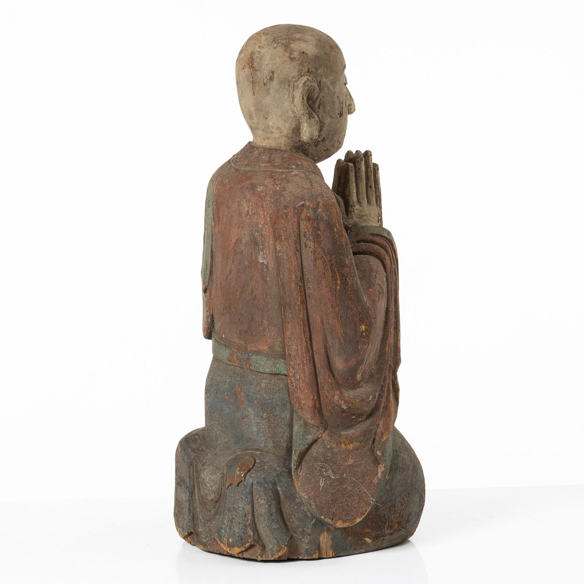 A Chinese sculpture of a louhan, 20th century.
