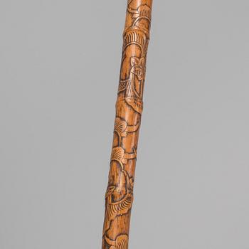 A CHINESE BAMBOO WALKING STICK, latter part of the 19th century.