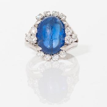 A circa 11.00 ct sapphire and brilliant cut diamond ring. Total carat weight of diamonds circa 1.00 ct.