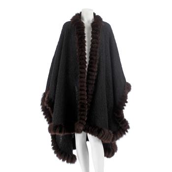 YVES SAINT LAURENT, a black wool and brown fur trimmed cape.