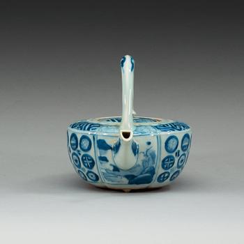 A blue and white Japanese tea pot with cover.
