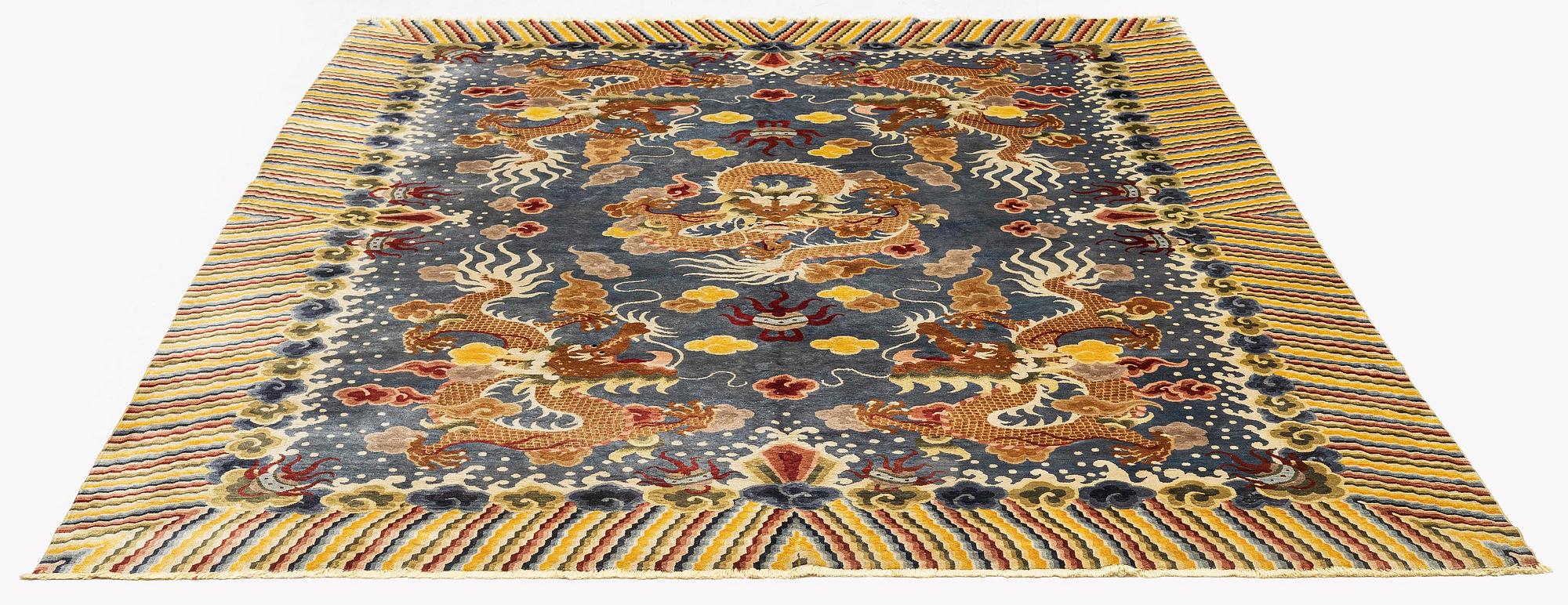 A semi-antique chinese ' Five dragon' silk carpet, c 335 x 254 cm.