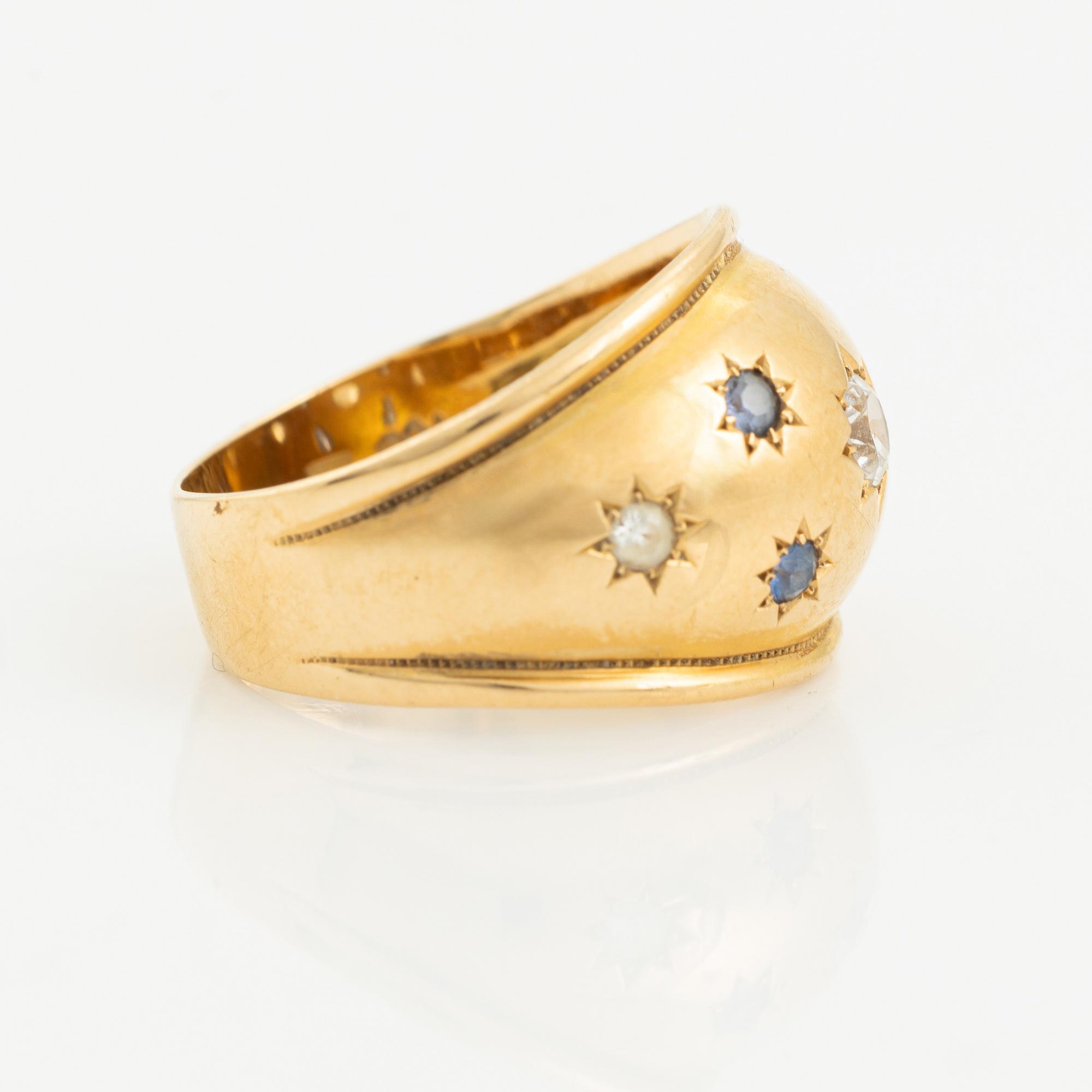 Ring 18K guld med safirer och vita stenar.