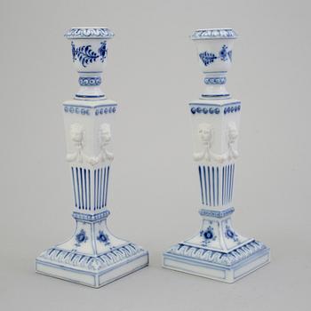 A pair of porcelain candlesticks and a lighter from Royal Copenhagen, Denmark.