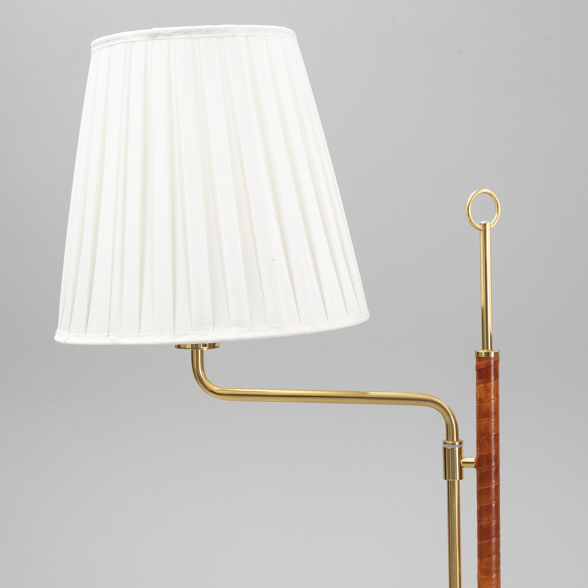 A pair of brass and leather floor lights, Örsjö Industri, 21st century.