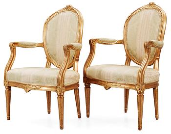 561. A pair of Gustavian late 18th Century armchairs.