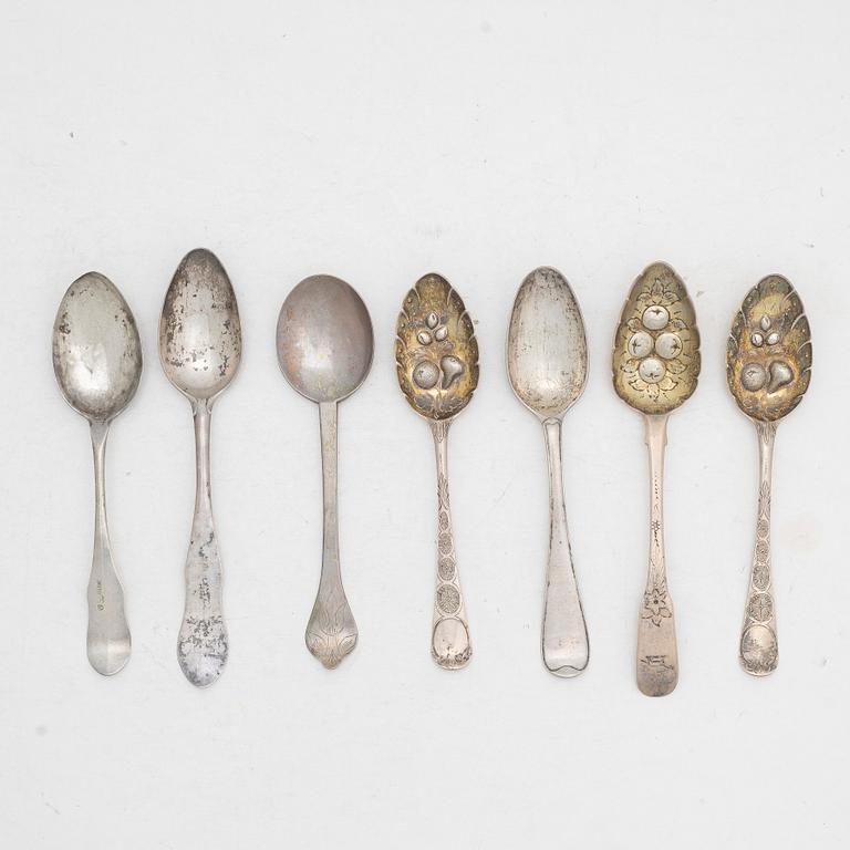Seven silver spoons, including English and Swedish hallmarks.