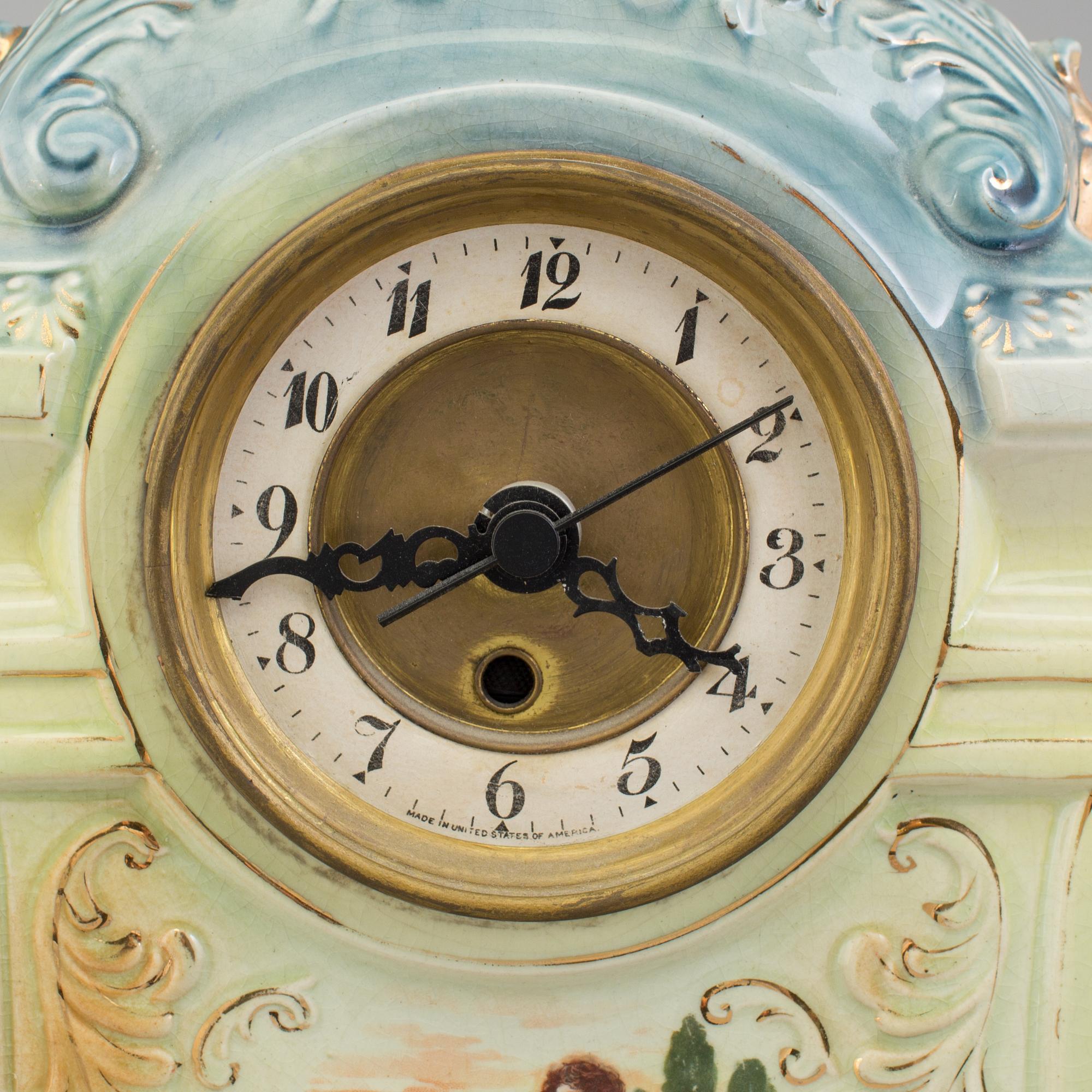 A creamware mantle clock, circa 1900.
