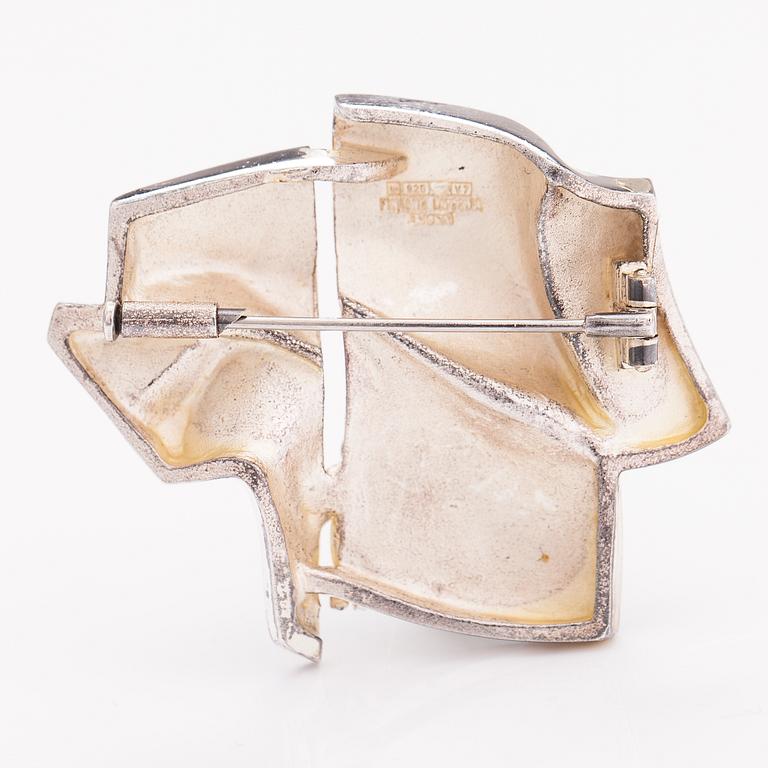 BJÖRN WECKSTRÖM, A sterling silver brooch "The stranger on Io". Lapponia 1974.
