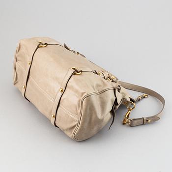 Miu Miu, a leather handbag.