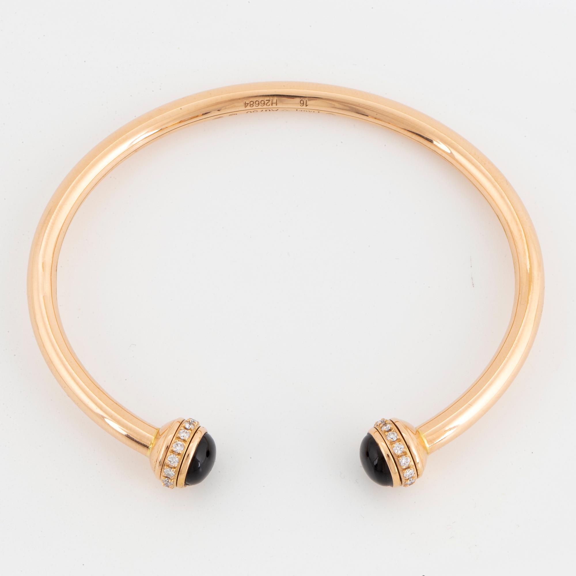 Piaget 18K rose gold, brilliant-cut diamonds and onyx cabochons.
