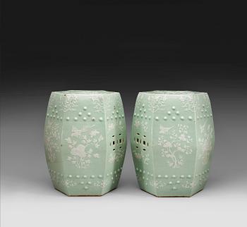 361. A pair of slip decorated celadon garden seats, Qing dynasty 19th century.