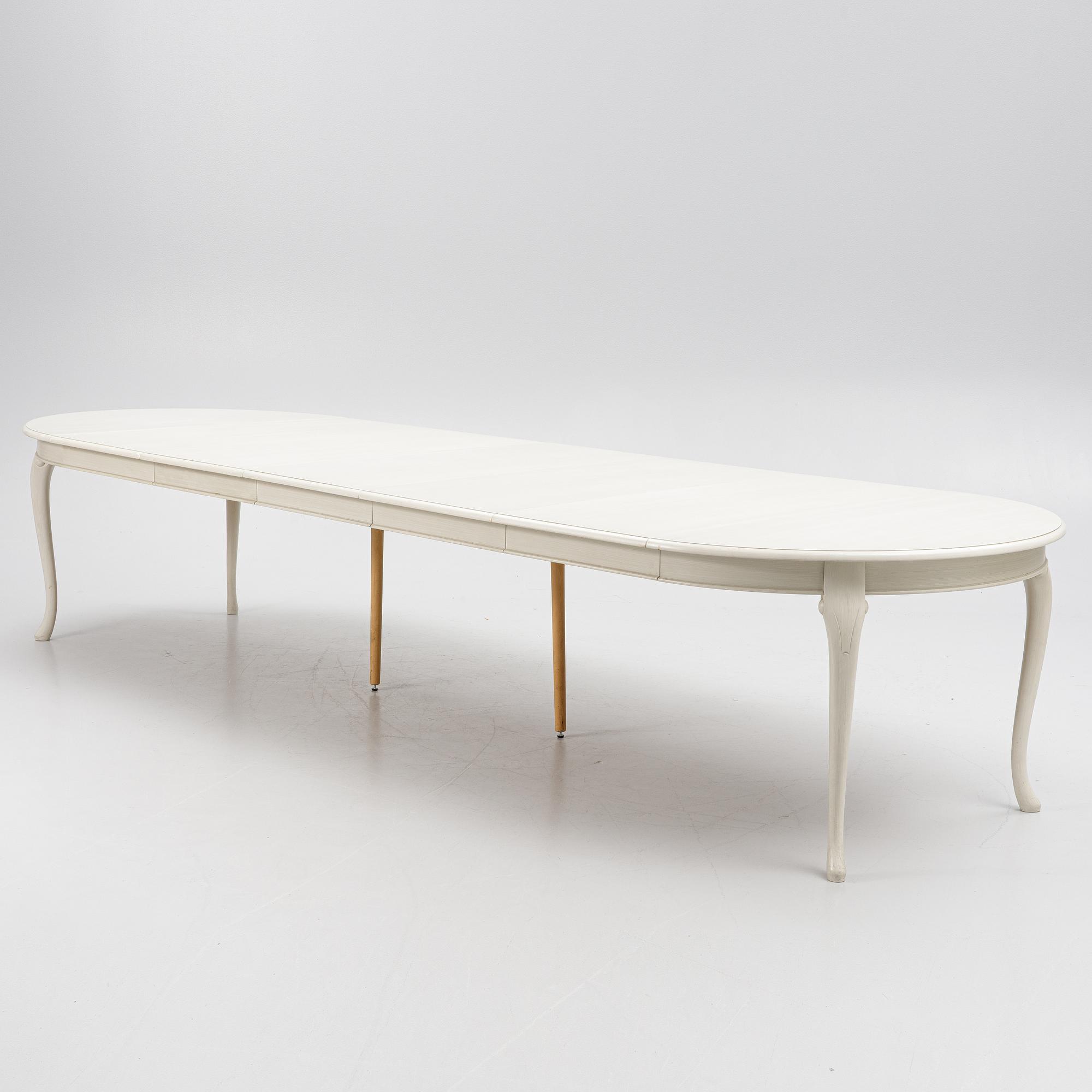 A Rococo style dining table and twelve chairs, KA Roos, Helsingborg, modern production.