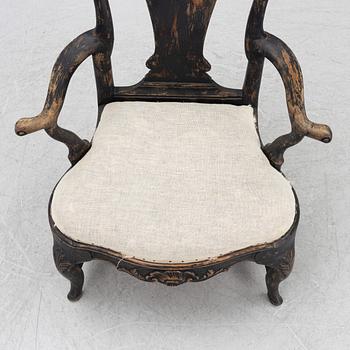 A Rococo armchair, later part of the 18th Century.