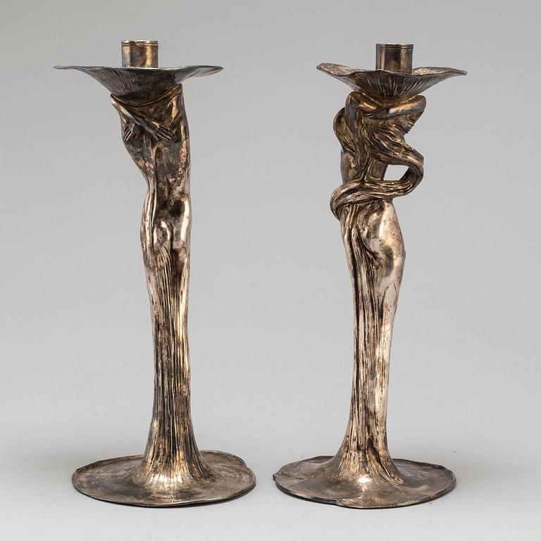A 20th Century pair of art noveau style candle sticks marked A.W.OX.