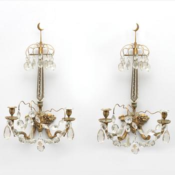 A pair of Louis XVI-style two-branch gilt-bronze and cut-glass appliques, larte 19th century.