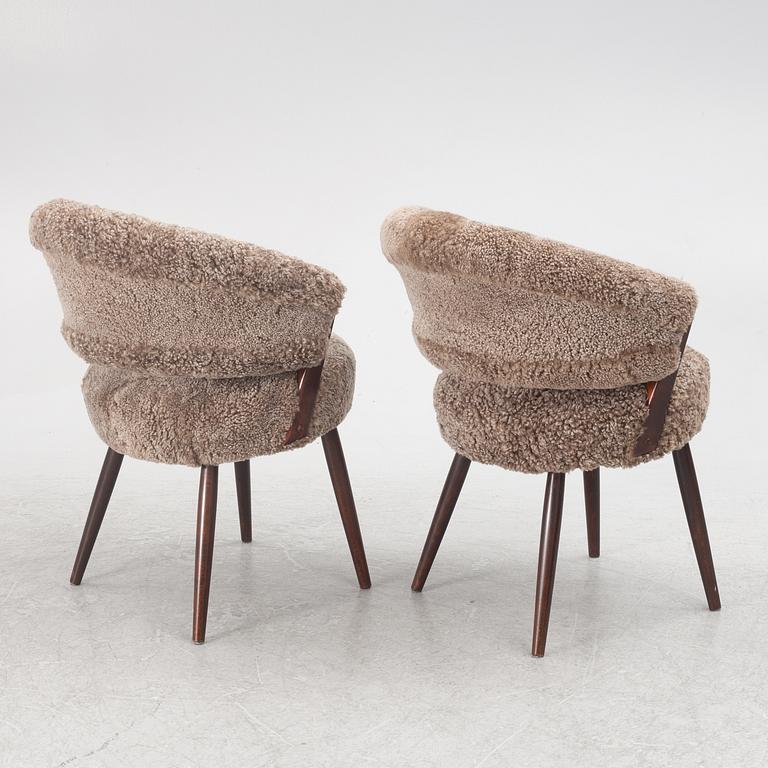 A pair of armchairs, AB Bröderna Biörs Snickerifabrik, mid-20th century.