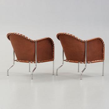 Mats Theselius, A pair of 'Bruno' brown leather and steel easy chairs, Källemo, Sweden.