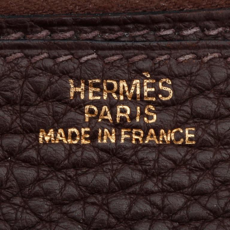 HERMÈS, a brown leather wallet, "Dogon".