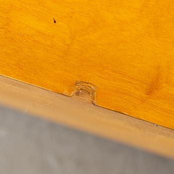 A 1930s birch and elm veneered shelf.