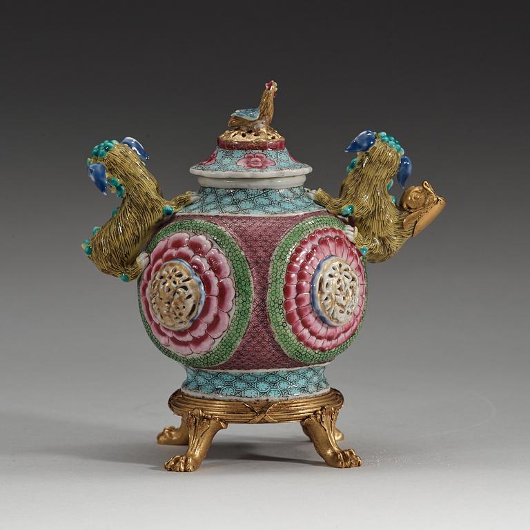 A gilt bronze mounted famille rose tea pot with cover, Qing dynasty, Yongzheng (1723-35).