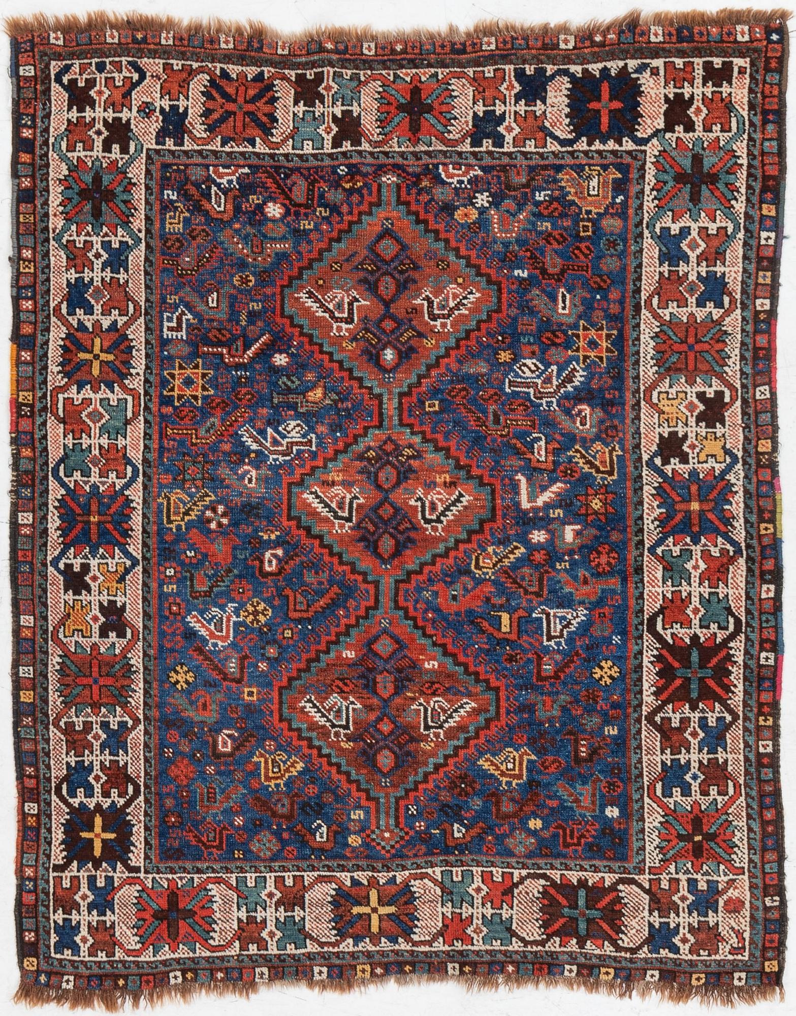 An antique Kamseh rug, c. 150 x 118 cm.