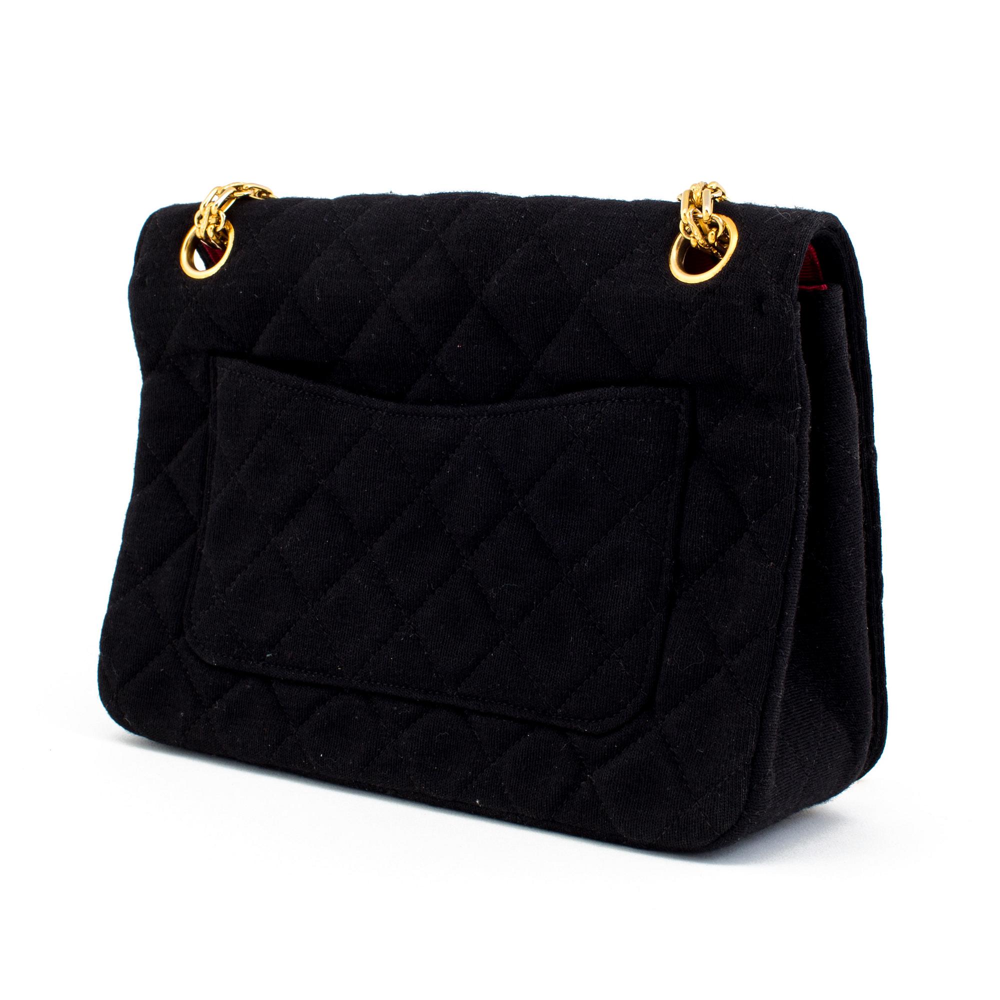 A black quiltet jersey handbag by Chanel.