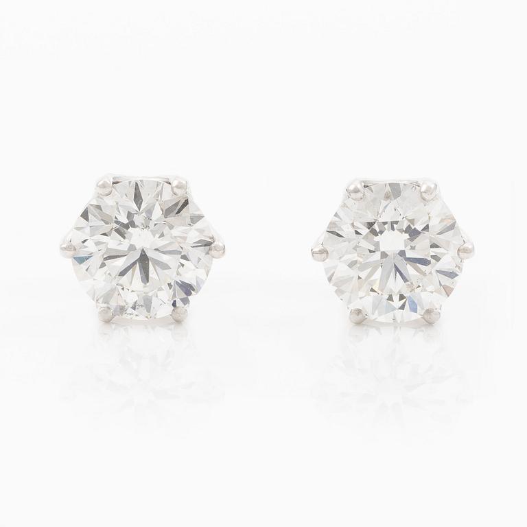 Earrings, single-stone earrings in 18K white gold with brilliant-cut diamonds, accompanied by IGI report.