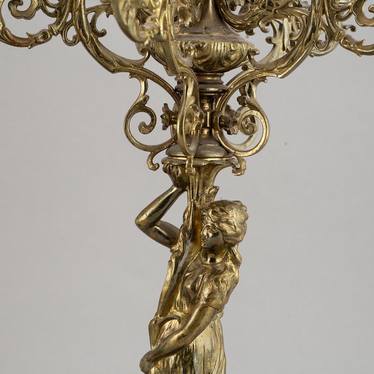 A pair of late 19th century brass candelabra for six candles.