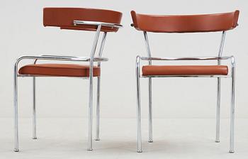 A pair of Gunnar Asplund chromed steel and leather armchairs by Källemo, Sweden post 1988.
