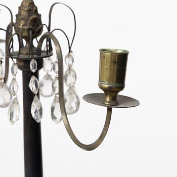 A pair of wooden candelabras, around 1900.