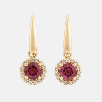 Pink tourmaline and brilliant cut diamond earrings.
